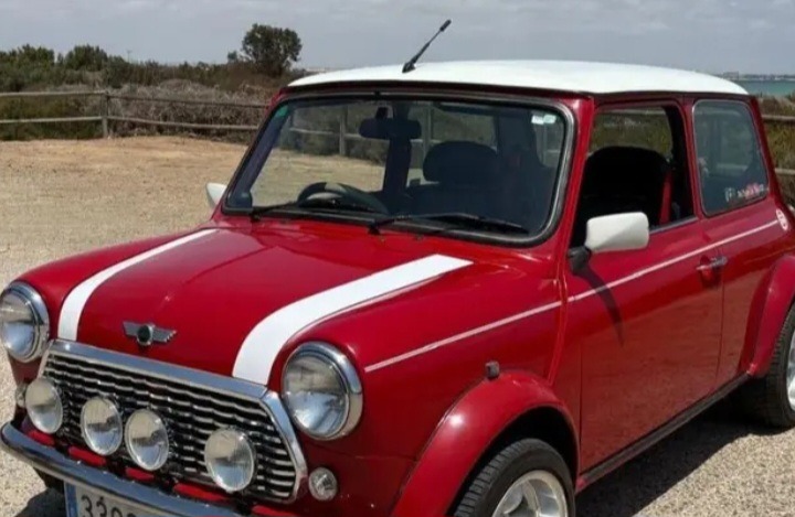 Classic British Red Mini Cooper with White Rally Stripes