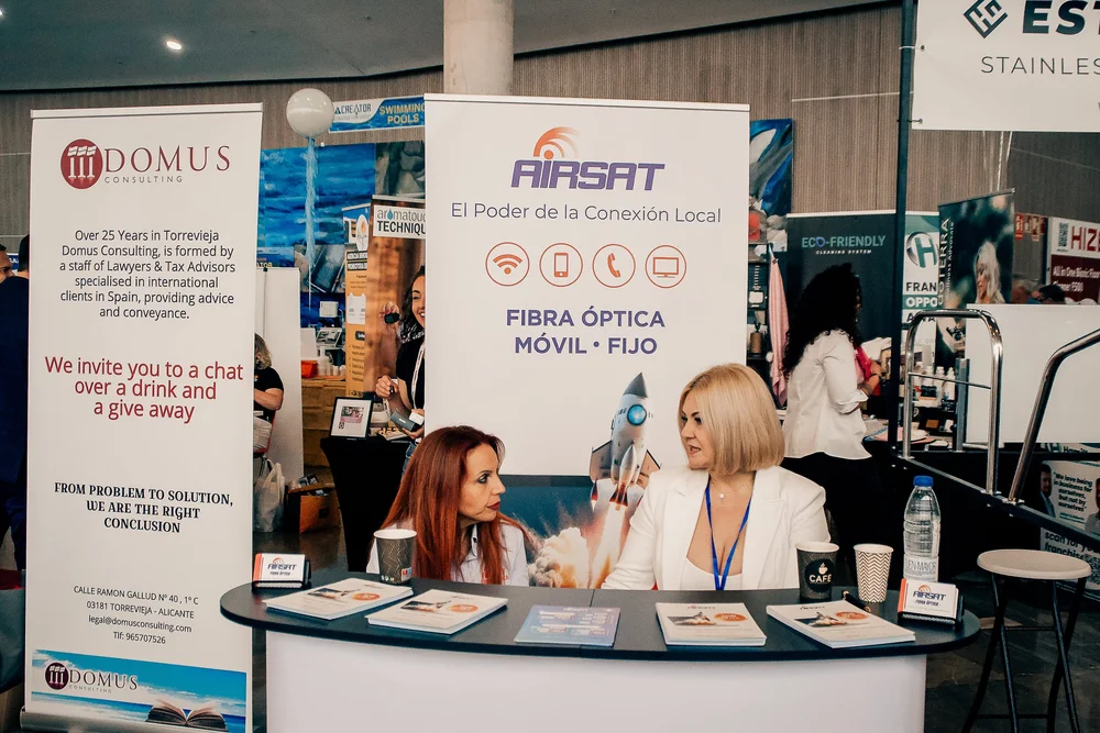 Domus Consulting and AirSat stands providing business consultations