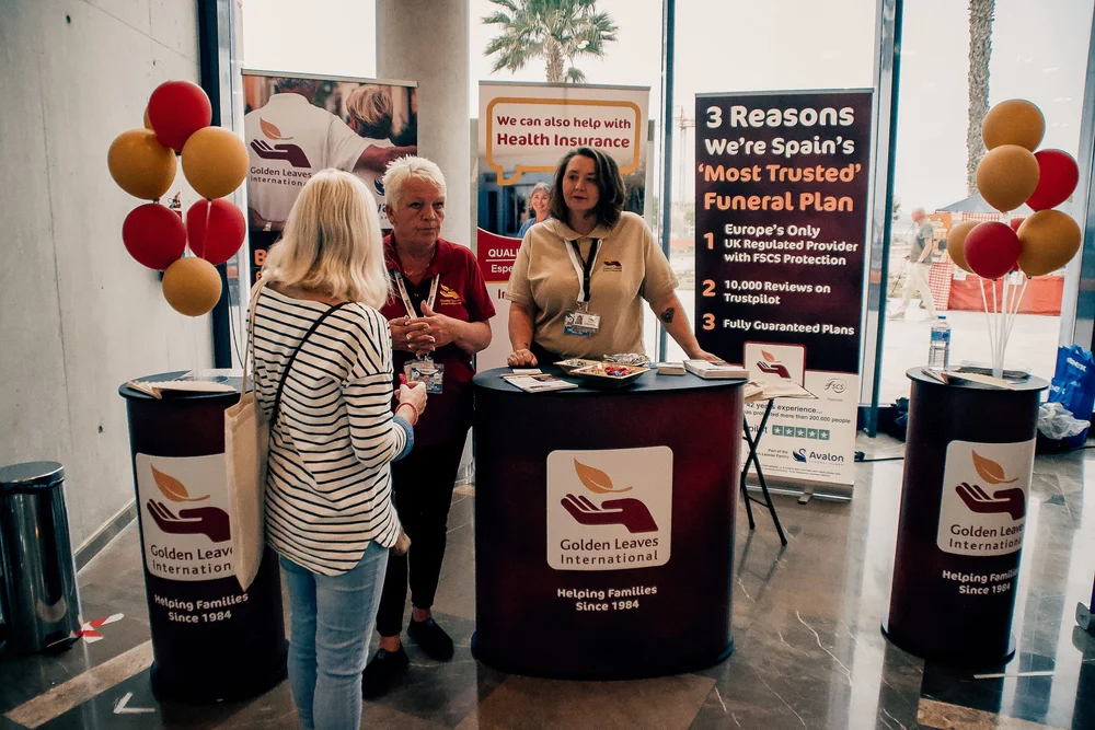 Golden Leaves International stand with advisors explaining family protection plans