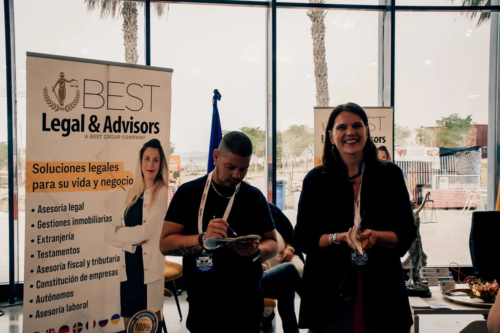 BEST Legal and Advisors representatives greeting visitors at their stand