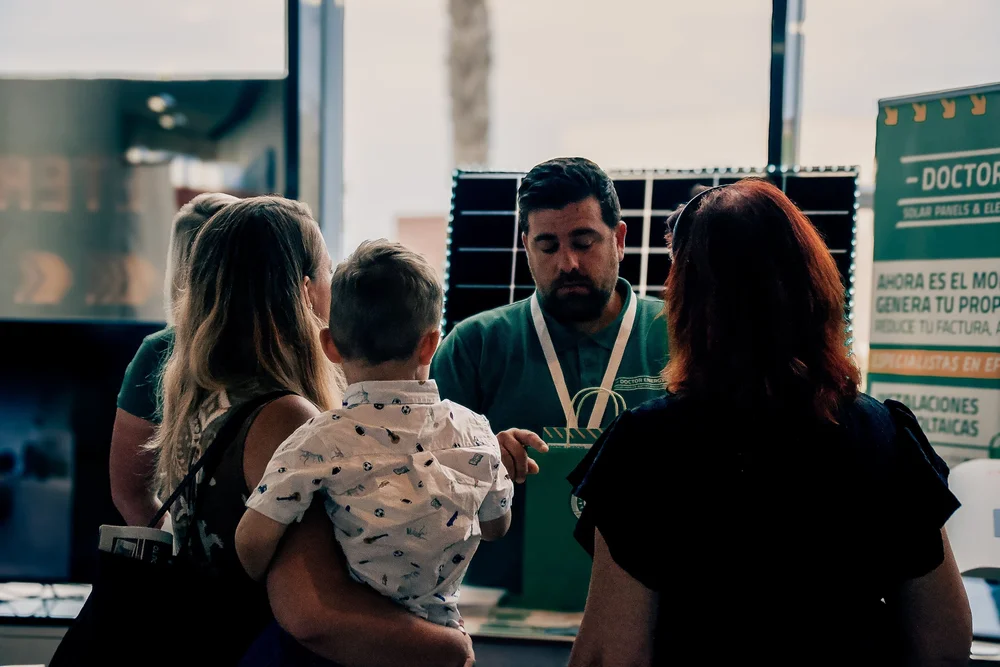 Homeowners learning how solar panels reduce household electricity bills