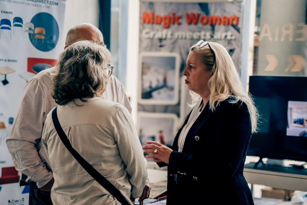 Furniture Direct and Magic Woman consultants in discussion with homeowners